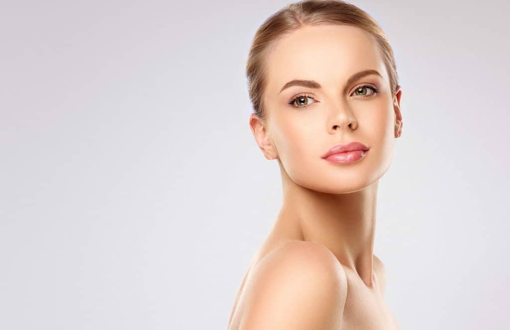 shutterstock 2453275621 Woman with clear, glowing skin after a chemical peel in Lubbock, TX